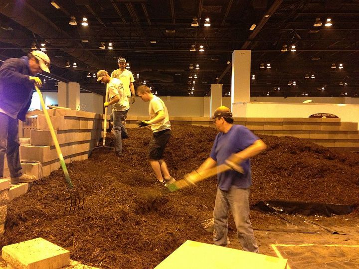 birth of a denver garden and home show garden, flowers, gardening, outdoor living, ponds water features, Moving the mulch around to start the water feature at Colorado Convention Center
