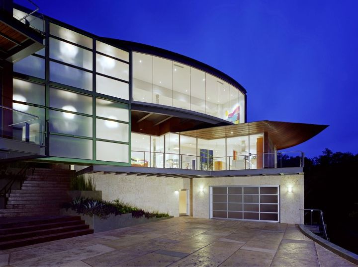 glass garage doors, Lights off on the same house as shown previously Clopay Avante Collection Clear Anodized aluminum frame with frosted glass panels Lights off