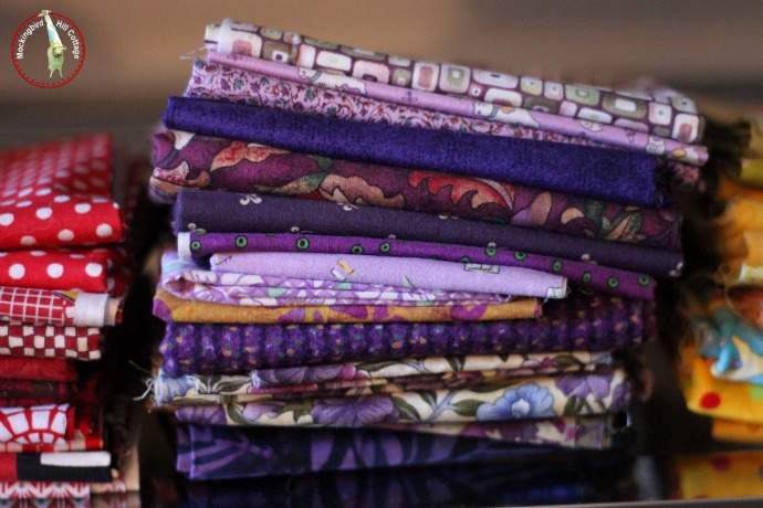 pondering purple, home decor, a stack of fabric in shades of purple