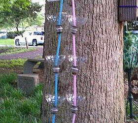 recycled soda bottles as hanging seedling rain chains, This gives you a better idea of what they look like There are 2 rain chains hanging from a plastic coat hanger There are 4 cups in each rain chain