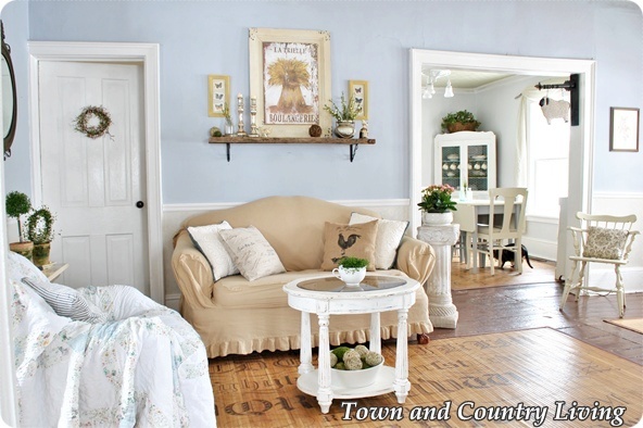 adding spring to the living room, home decor, living room ideas, Touches of greenery and a new French Boulangerie sign lighten the room decor for spring