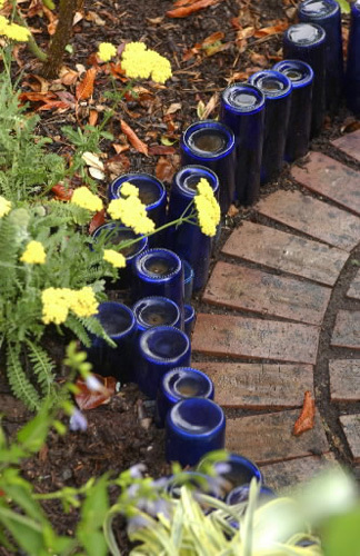 blue bottles and beer bread, repurposing upcycling, The easiest garden edge ever