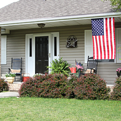 celebrating the red white and blue in style, outdoor living, patriotic decor ideas, seasonal holiday decor, The whole porch doesn t quite fit in this photo I think I need to trim my barberry bushes a little