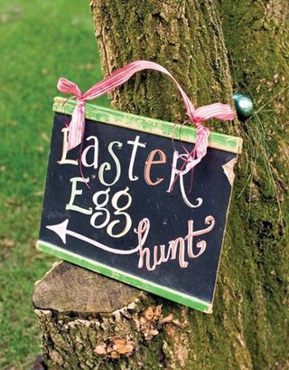 easy easter decorating, christmas decorations, easter decorations, seasonal holiday d cor, An old chalkboard or even a new one very inexpensive with a touch of paint and ribbon You can change the message year to year or use it as a Bunny countdown