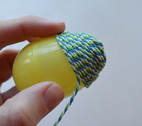 baker s twine easter eggs, crafts, easter decorations, seasonal holiday decor, Begin wrapping the baker s twine adding little dabs of hot glue where needed Continue wrapping until you reach the other end Carefully cover the other end by winding your twine in little circles
