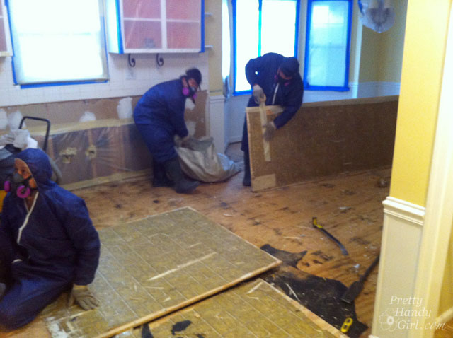 beware of asbestos especially after a disaster strikes, home maintenance repairs, An asbestos abatement team at work
