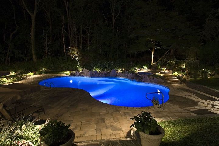 pool patio too hot concrete paver slabs look like stone with low heat, LOw voltage landscape lighting and LED pool lighting make this pool awesome at night