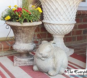 a southern porch reveal for spring 2014, curb appeal, flowers, gardening, porches, seasonal holiday decor, wreaths, Garden bunnies and flower planted urns stand guard on each side of the front door