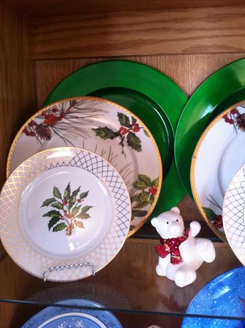 christmas china hutch decor, christmas decorations, seasonal holiday decor, Shiny green chargers sit behind my very favorite Christmas plates from Kohl s