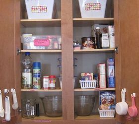kitchen organization, closet, diy, shelving ideas, storage ideas, woodworking projects, I created a separate baking cabinet Cookie cutters are contained on the top shelf since they are rarely used Cake decorating supplies are held in a plastic shoe box Measuring cups spoons are also kept in this cabinet