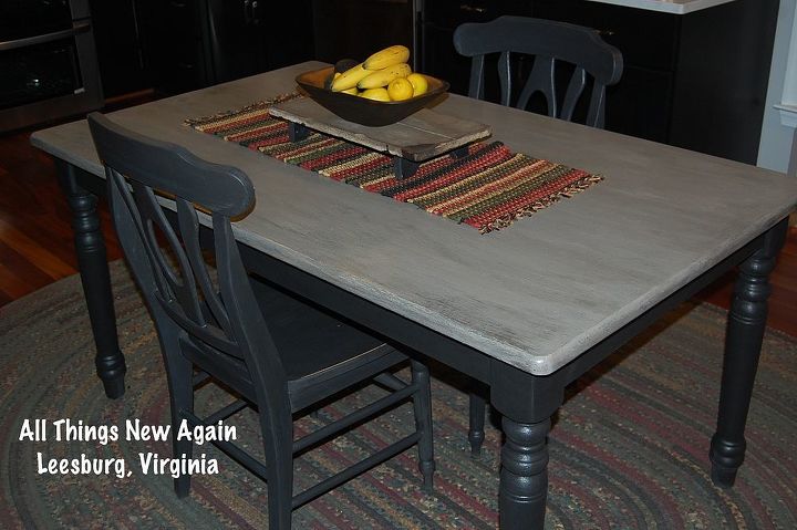a new look and a new home for a cute farm table, painted furniture, This farm table was in rough shape when my mom spotted its legs sticking out from a pile of furniture in my garage She transformed it with several swirly shades of gray and black from American Paint Company
