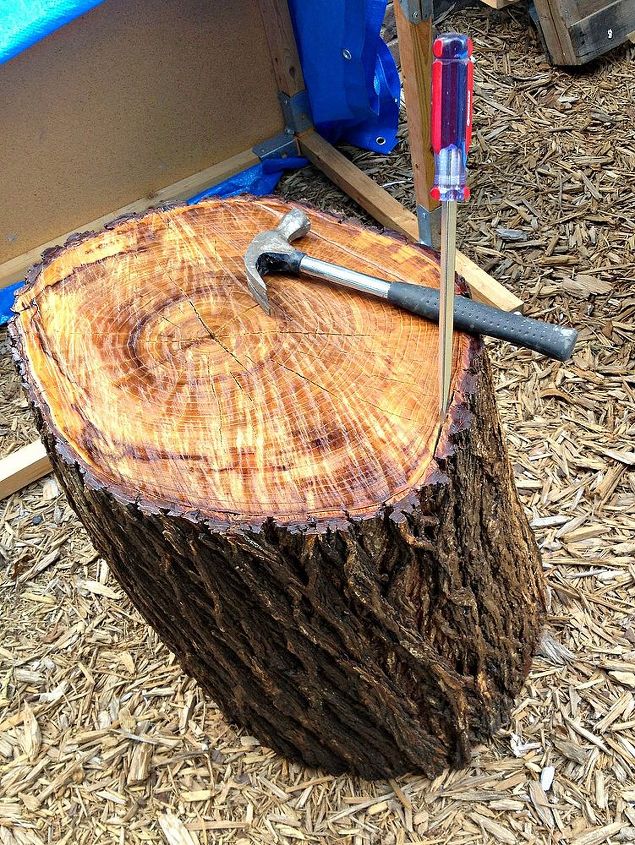 how to simple stump stool with caster wheels, repurposing upcycling, seasonal holiday decor, We peeled off the bark Ours came off in two large pieces Sand and seal the stump if desired