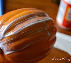 how to decoupage paper pumpkins, crafts, decoupage, seasonal holiday decor, Work is small sections putting the Mod Podge on the pumpkin