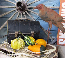 outdoor fall decor, outdoor living, patio, seasonal holiday decor, Vintage lunch box wagon wheel gourds and rusty bird on a wood crate