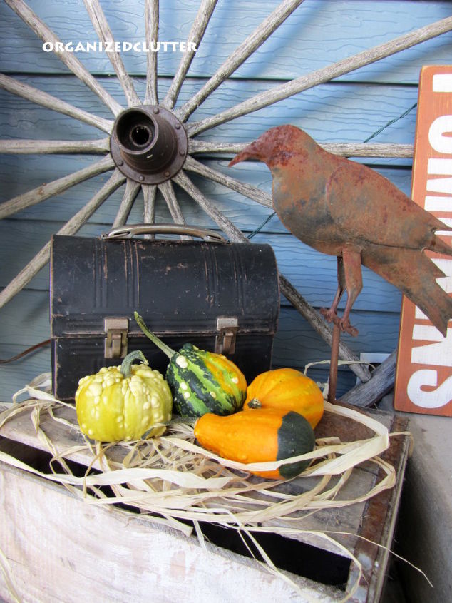 outdoor fall decor, outdoor living, patio, seasonal holiday decor, Vintage lunch box wagon wheel gourds and rusty bird on a wood crate