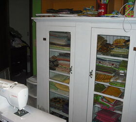 quilting room in our home we just sold a while ago, craft rooms, home decor, organizing, Last thing my honey took his grandpas gun cabinet and made me a cabinet for my material he made shelves and put them in how sweet to give it up hehe looks nice huh and organized for a change well that was my room