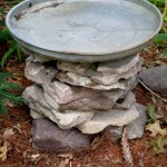 stacked stone bird baths, outdoor living, repurposing upcycling, When the stacked stone is the height desired add the galvanized lid One down and two more to go