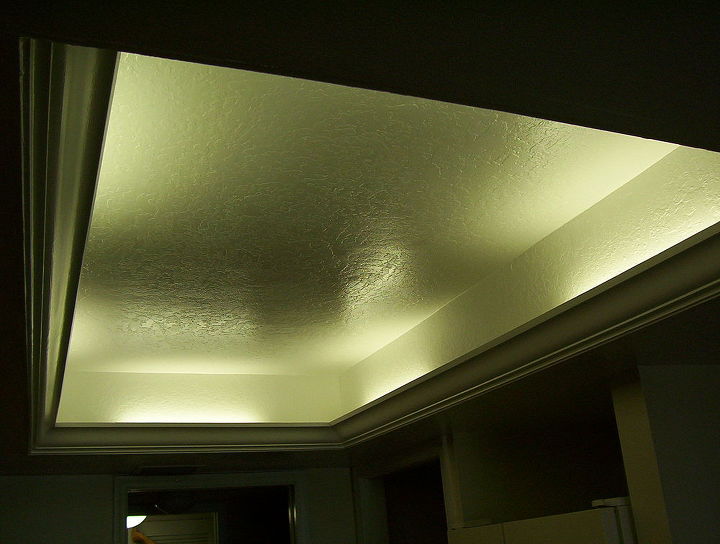 what to do with that 1980 s style kitchen lighting, Florescent or LED lights can be installed behind the crown molding for an elegant look