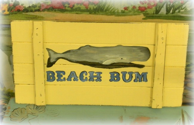 decorating your beach home with upcycled finds, home decor, repurposing upcycling, shabby chic, This cute whale wall plaque started out as an old cabinet door