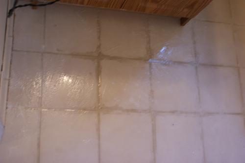 removing dried on grout and refreshing grout lines, cleaning tips, home maintenance repairs, tiling, An Oxiclean and water mixture forms a runny paste that sits on the floor for a few minutes