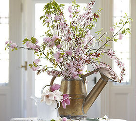 plant fashion 7 glamorous potting ideas, container gardening, flowers, gardening, succulents, Watering cans If you have a watering can that s seen better days give it a new life by planting small flowers in the base of it We re especially fond of this cherry blossom arrangement from Karin Lidbeck Brent
