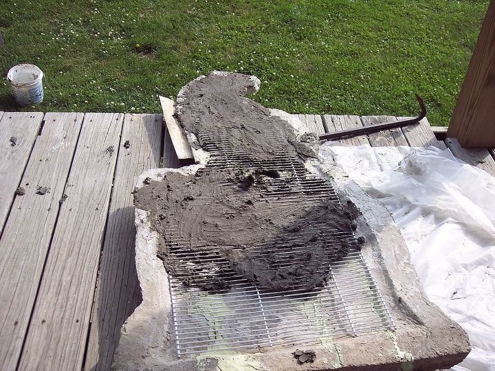 restoring a 65 year old cement statue, crafts, diy, how to, Then the guys mixed quick set cement to seal the rebar in place