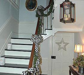 the painted floor entry with winding staircase, christmas decorations, flooring, foyer, seasonal holiday decor, stairs