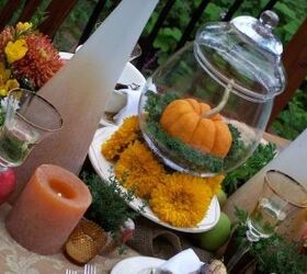 autumn tablescape, seasonal holiday decor, The centerpieces is accented with tall vases filled with twigs chunky candles and a collection of smaller votives and vintage glasses used as vases