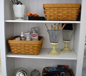 how to make a craft table, One side of the bookcase holds a variety of supplies