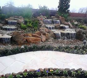 stunning pondless waterfall is the focal point of this backyard near houston texas, landscape, outdoor living, ponds water features, Finished in time for Christmas What a great present to the family
