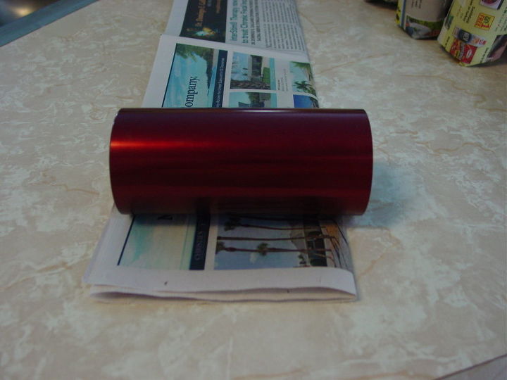 create newspaper pots, crafts, repurposing upcycling, roll your container i am using metal glass