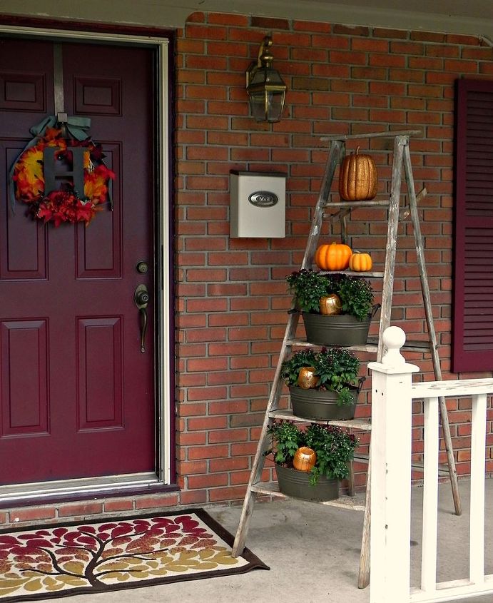 diy pumpkin watering system for mum, container gardening, gardening, porches, seasonal holiday decor, Our front porch all decked out for Fall
