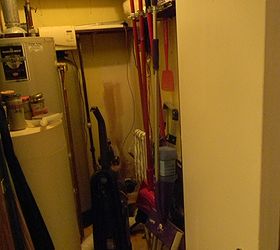 what would you do with an l shaped laundry room, home decor, laundry rooms, A week after moving in we tapped into city water This room originally had a well tank towards the back right Now everything seems to just be tossed in there We only have 2 baths in our house wouldn t this be a nice one