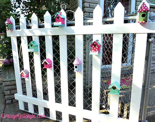 birdhouses dress up a plain picket fence