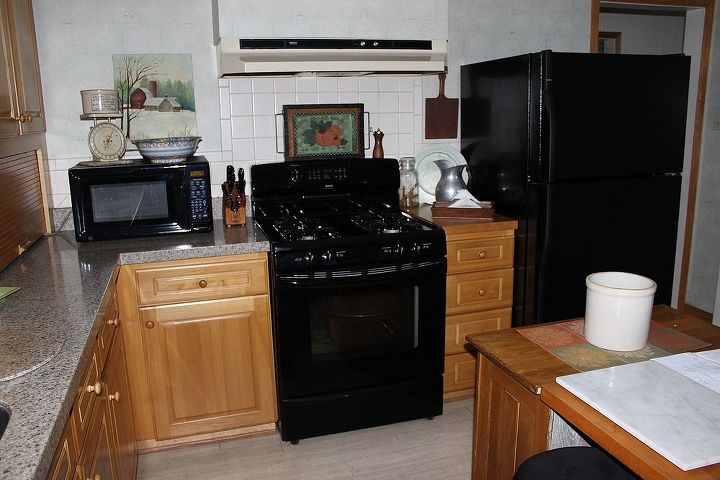 how to tie in an above the fridge cupboard and an existing bulk head, A slightly closer image of our appliance wall showing the open space I am talking about left and right of the exhaust fan