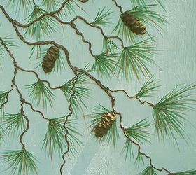 a cute shed make over, diy, outdoor living, woodworking projects, Hand painted and stenciled pine needles give the branches fullness I then cast our pine cone mold to create real looking pine cones They were sealed with exterior paint and glued on with construction adhesive
