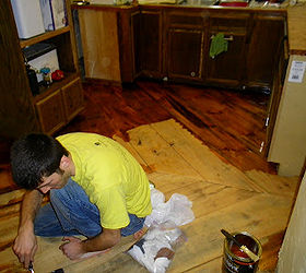 reclaimed barn wood kitchen floor, flooring, Putting on the first coat of polyurethane