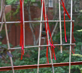 urban hedges part two bamboo trellis, flowers, gardening, outdoor living, pets animals, urban living, It has been said that red ribbons attract humming birds to a garden but I did not find that to be the case when I hung the stands of red from my trellis urban hedge INFO