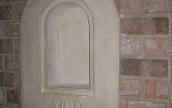 This niche is in a brick wall over the bar and next to the entry door of the wine cellar.