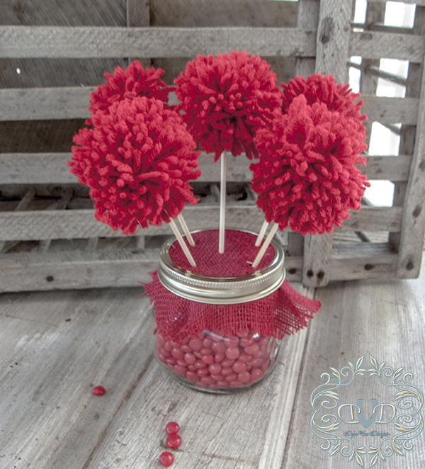 red hots pom poms and cupcake holders valentines day gifts, crafts, mason jars, seasonal holiday decor, valentines day ideas, Insert your pom poms attached to cake ball sticks