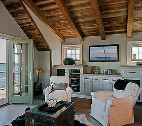 2012 hobi award for best residential remodel 750 000 1 million, architecture, home decor, home improvement, The third floor cathedral ceiling has weathered barn board and exposed rough sawn beams Custom built cabinetry holds entertainment systems and a small refrigerator The room opens to an Ipe wood deck with stunning views of the water