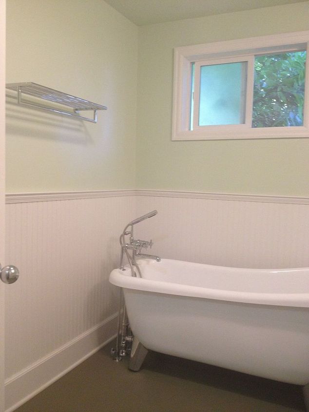 claw foot tub and wainscot, bathroom ideas, wall decor