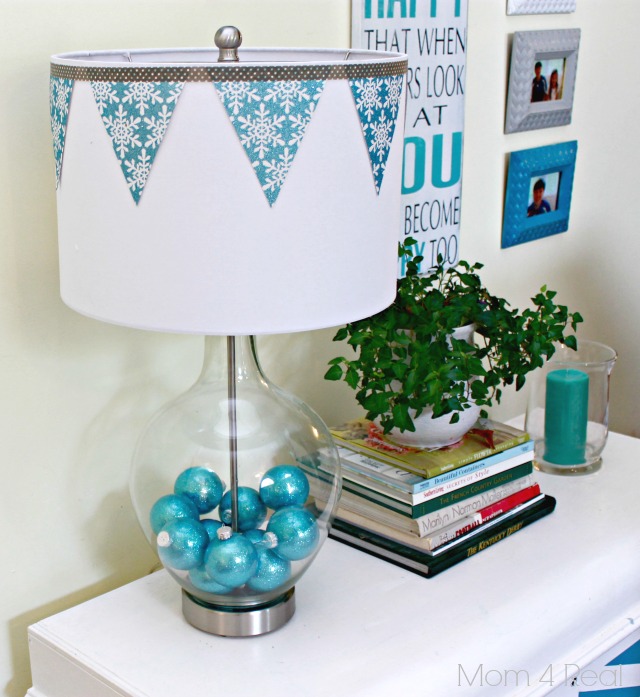 decorate a fillable glass lamp for the holdays, home decor, lighting, Lamps filled with ornaments and shade decorated with snowflake bunting