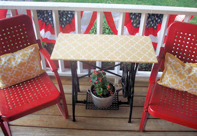 i miss my porch when s spring summer, home decor, outdoor living, porches, The tabletop is a cabinet door that went through multiple coats of paint and changes of mind first white then yellow then stenciled And I was psyched to find placemats that closely match the stencil to make into pillows