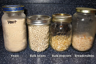 reusing jars for bulk food storage, organizing, repurposing upcycling, storage ideas, Glass jars hold yeast stored in the freezer beans popcorn and homemade breadcrumbs also stored in the freezer