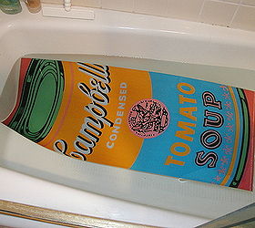 decoupage kitchen cabinets with andy warhol posters, home decor, kitchen cabinets, kitchen design, I cut the posters to fit the cabinet doors and put them in a bathtub of water to relax the paper This way the paper would be easier to work with Don t worry the ink doesn t run