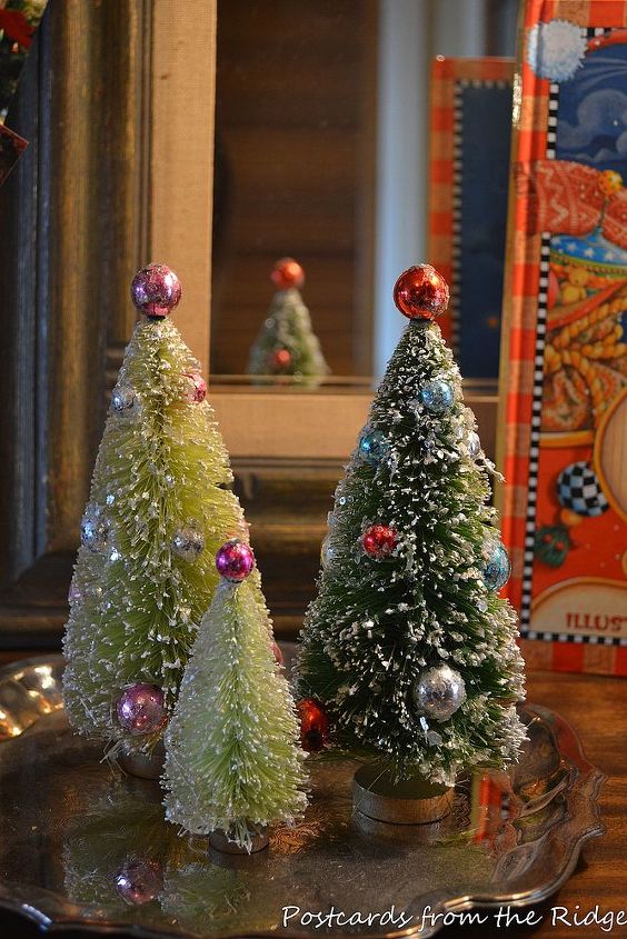 holiday tour of our guest bedroom, bedroom ideas, christmas decorations, painted furniture, seasonal holiday decor, Down the hall in our entry these sweet bottle brush trees that I bought last year greet us when we come home