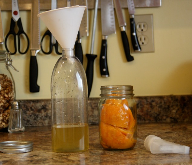 diy natural grapefruit all purpose cleaner, cleaning tips, composting, go green, Straining off the grapefruit This is the undiluted grapefruit vinegar on the left