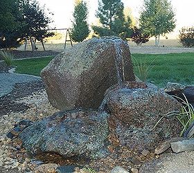tis a privilege to live in colorado, outdoor living, ponds water features, This spouting rock in Erie Colorado adds the soothing sound of water to this family s front door