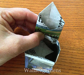 origami paper seedling pots from newspaper, Then do the same thing on the right side reversing the crease You now have a pointed tab on top which you will fold into the center tucking the point into the bottom of the pot